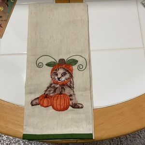 Halloween tea towel with kitty and pumpkins. Brand new